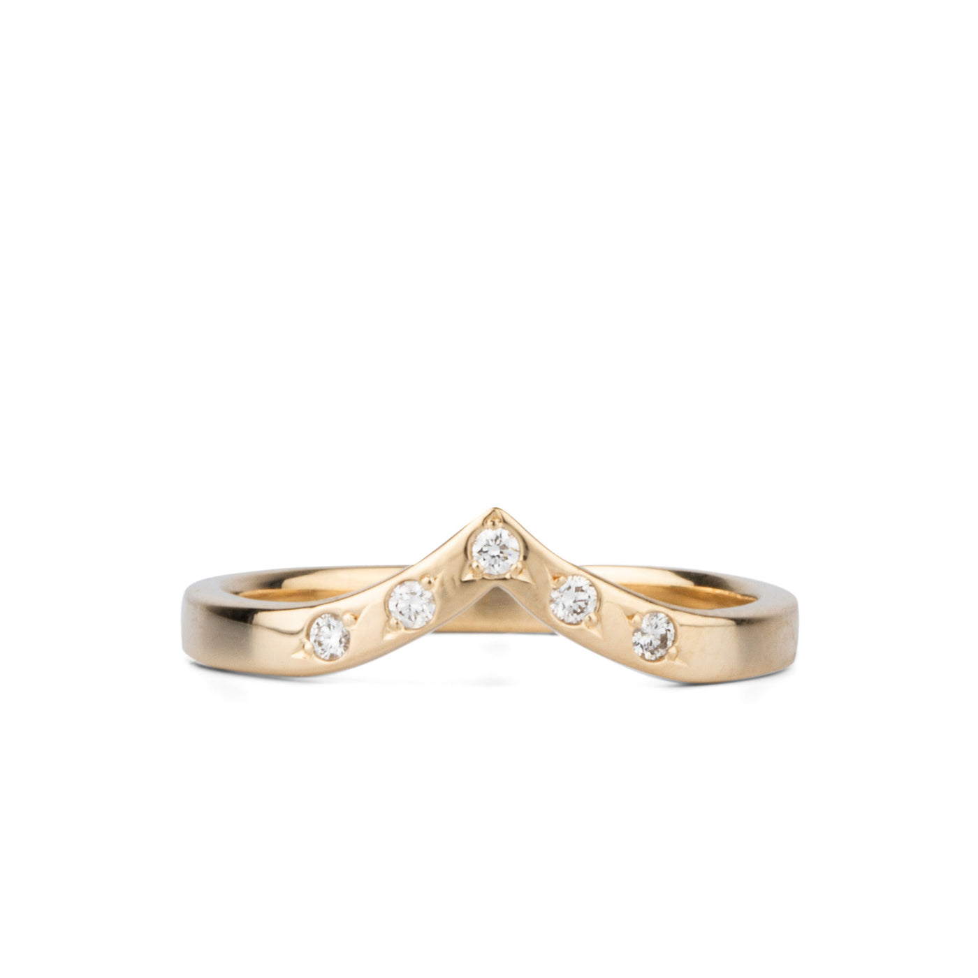 Peaked 14k yellow gold band with five white diamonds in delicate star settings on a white background
