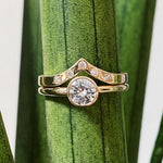 Pinnacles White Diamond Peaked Band paired with a round moissanite solitaire