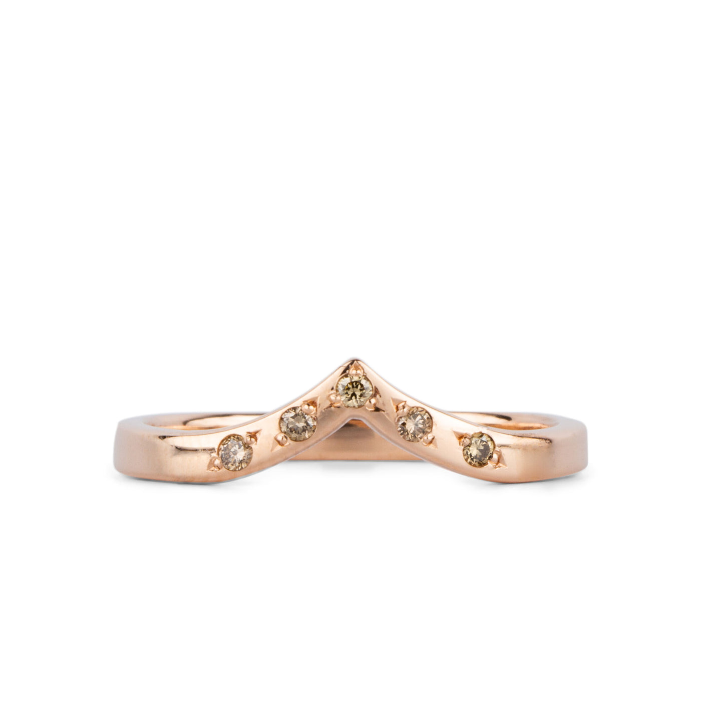 Peaked 14k rose gold band with five champagne diamonds in delicate star settings on a white background
