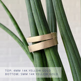 Yosemite flat stippled texture wedding bands in yellow gold in 2 widths: 4mm wide (top) and 5mm wide (bottom)