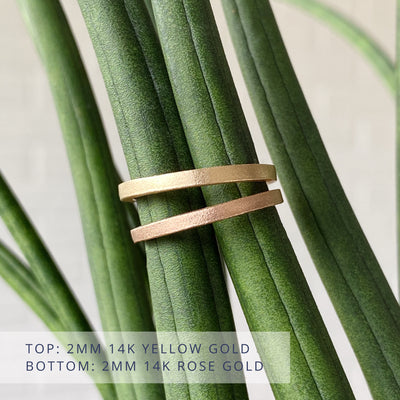 Yosemite stippled matte texture flat wedding bands. Top is 2mm wide and 14k yellow gold, bottom is 2mm wide and 14k rose gold. 