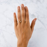 14k yellow gold vertical hammered flat Zion Band on a hand by Corey Egan