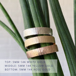 Wide Zion flat vertical hammered wedding bands 5mm wide in 3 colors: 14k white gold (top) 14k yellow gold (middle) and 14k rose gold (bottom)