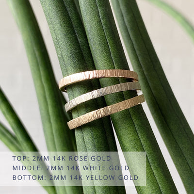 Thin Zion 2mm wide vertical hammered flat wedding bands in 3 colors: 14k rose gold (top) 14k white gold (middle) and 14k yellow gold (bottom)