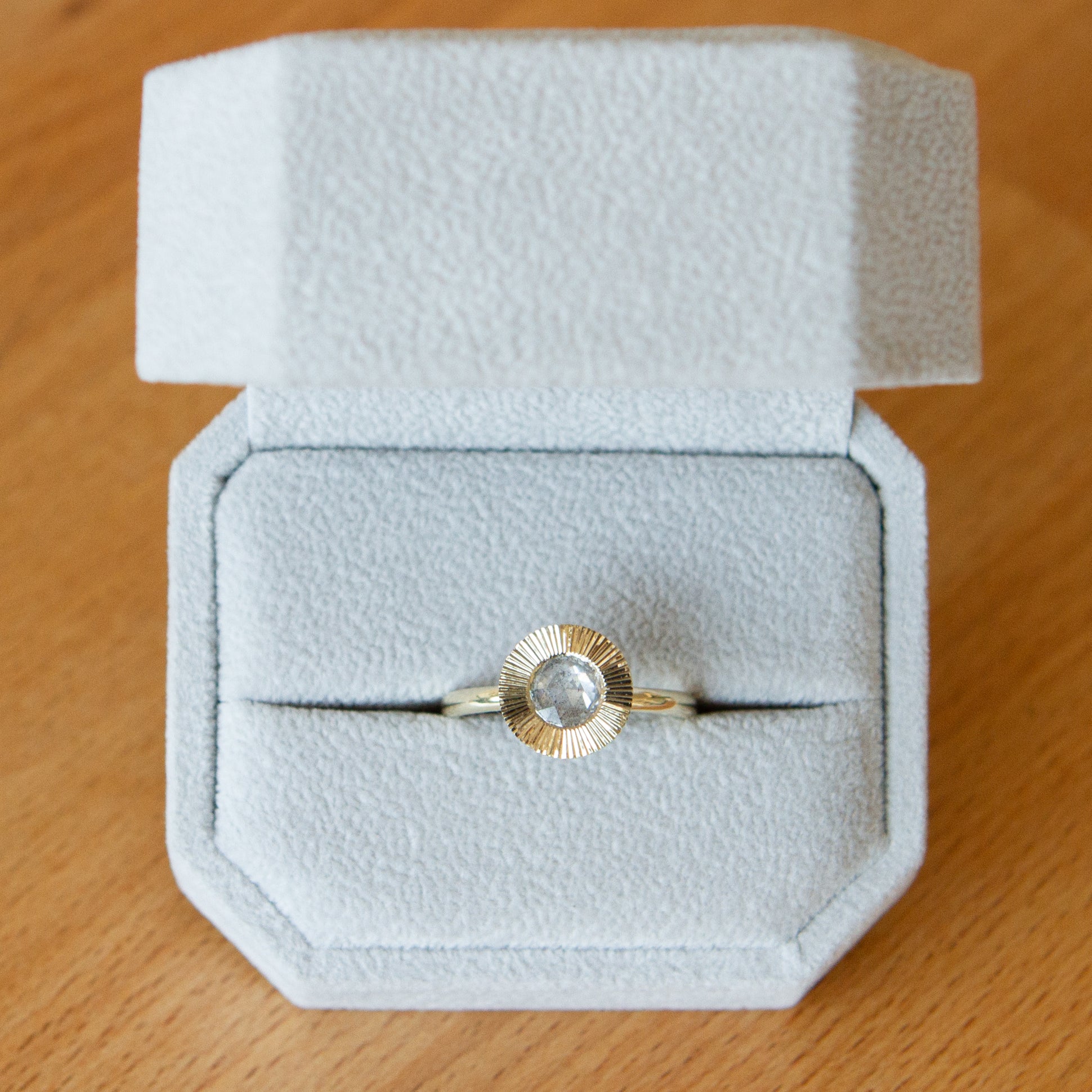 Icy Rose Cut Diamond Aurora Ring packaged in a ring box