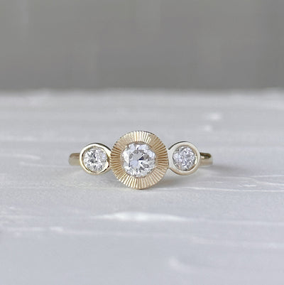 Polaris Ring with Old European Cut Diamond in front of a white wall, front angle