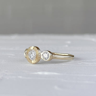 Polaris Ring with Old European Cut Diamond in front of a white wall, side angle