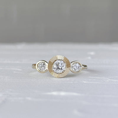 Polaris Ring with Old Mine Cut Diamond in front of a white wall, front angle